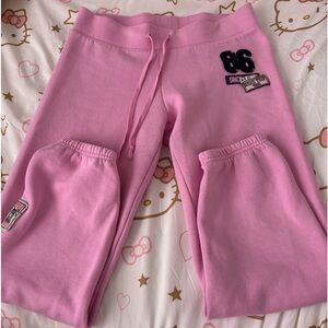 Pink sweatpants with a cute design on the back